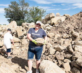 Woman carrying a large stone at the rock quarry
