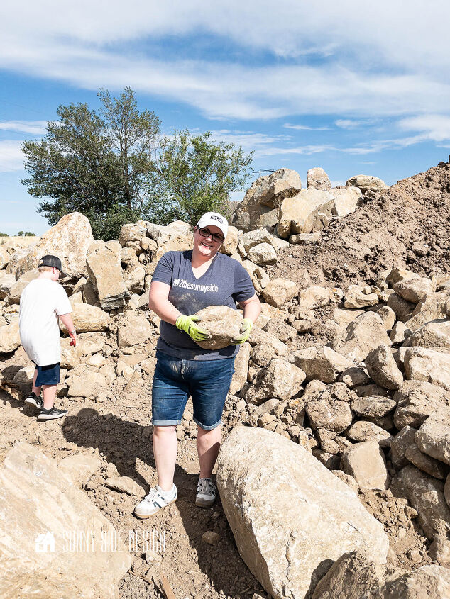 Woman carrying a large stone at the rock quarry