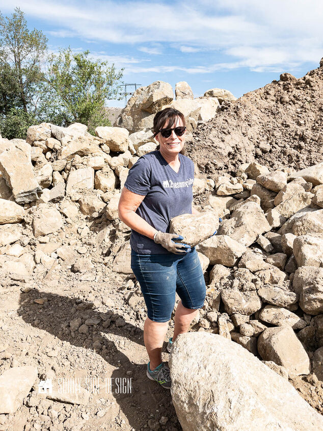 Woman carrying a large stone at the rock quarry