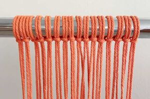 Wrap rope around a pole for this beautiful way to dress up your home this season