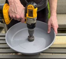 Drill 2-inch holes in the center of the planter and saucer to fit the outdoor umbrella