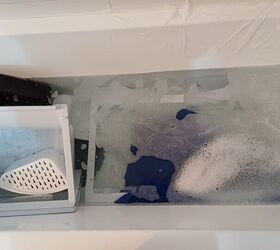 Soak the refrigerator drawers and shelves in warm soapy water