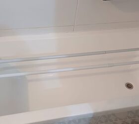 Place tension rods across the bath