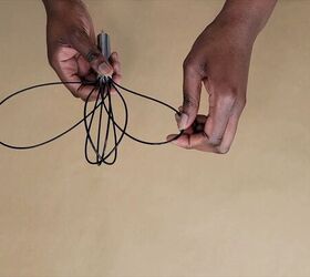 She bends 2 dollar store whisks out of shape for this brilliant idea