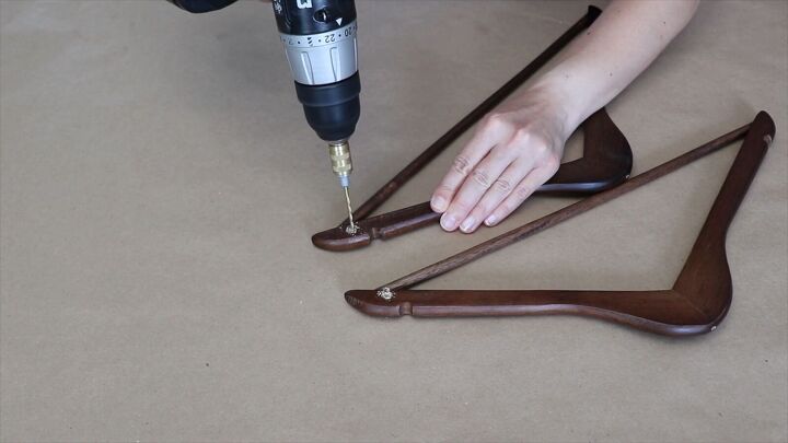 Drill holes in hangers to begin assembling our hanger bed desk