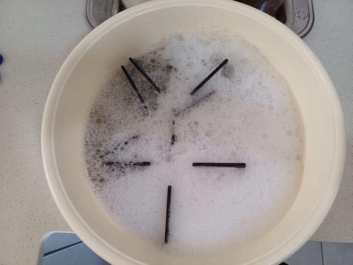 Soaking burners helps soften grease for easier cleaning later