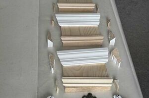 She glues pieces of leftover molding onto a board for this beautiful idea