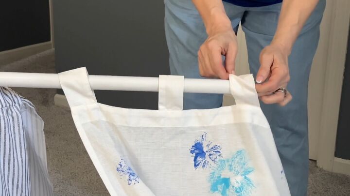 Thread the curtain panels onto the rod