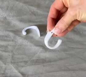 She hangs coat hooks above a bedroom window—& it's the fastest high-end trick we've seen