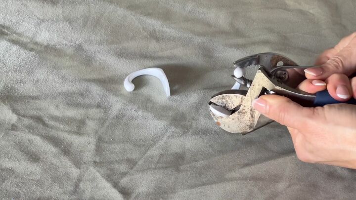 Use a wrench to adjust the J-hooks for easier installation