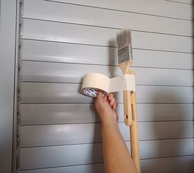 A paintbrush on a broom handle makes dusting your ceiling a breeze!