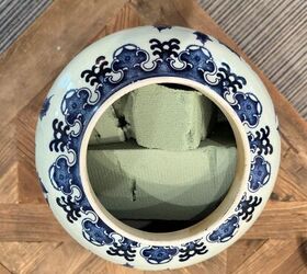 She stuffs foam into a big vase for a fall decor idea that will make jaws drop