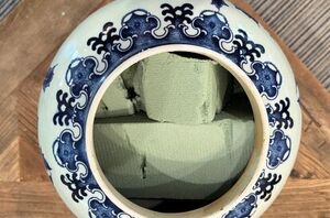 She stuffs foam into a big vase for a fall decor idea that will make jaws drop