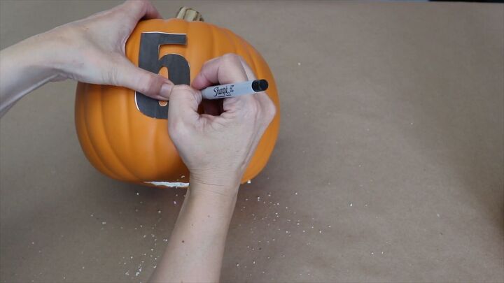 Tape your printed numbers onto the pumpkins for easy tracing and carving