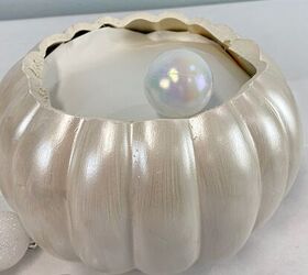 Fill a pumpkin with Christmas ornaments for this wild decor idea