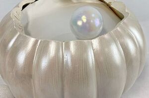 Fill a pumpkin with Christmas ornaments for this wild decor idea