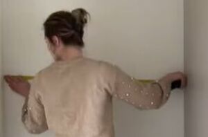 She measures the wall behind her kitchen door for this clever storage idea