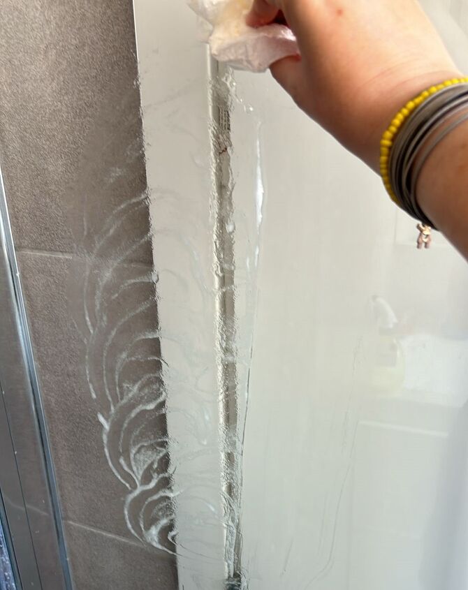 No more hard water spots—this homemade shower glass cleaner leaves doors gleaming