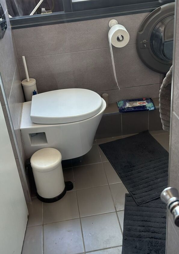 Rinsing off the homemade shower cleaner—say hello to a clear, streak-free shine!