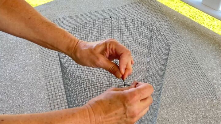 Twisting the wire ends to secure the top mesh