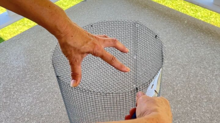 Attaching the top mesh piece to complete the structure