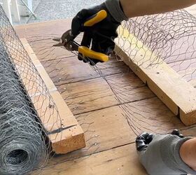 Cutting chicken wire into squares for the flower base