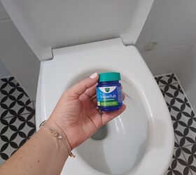 She spreads a small amount of VapoRub inside the rim of her toilet for this quick trick