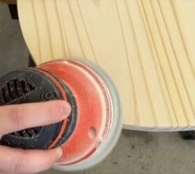 Sanding the edges of the board with an orbital sander