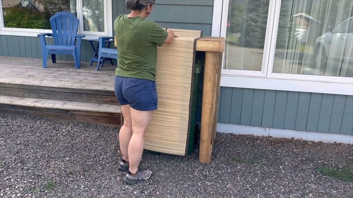 Bamboo beach mat being added to the front of the enclosure