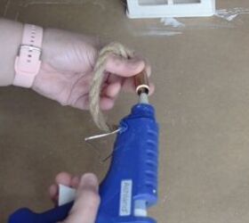 Rope being threaded through the small copper pipe