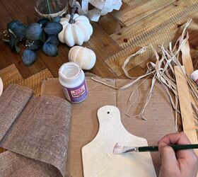 She brushes some Mod Podge on this cutting board for this idea that's giving us ALL the fall vibes
