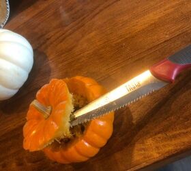 She cuts the tops off of real pumpkins for this unexpected decor idea