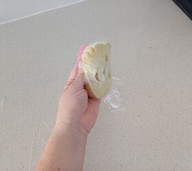 Sponge being used to scrub a countertop