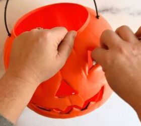 There's a super simple way to make your porch look amazing with this quick pumpkin bucket hack