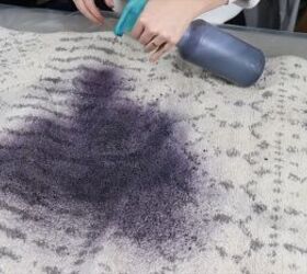 Spraying dye onto the rug