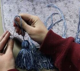 Using the darning needle to attach tassels