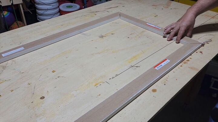Dry fit the trim around your TV before applying wood glue to secure the pieces