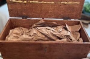 She stuffs kraft paper in a box for this sweet fall accent