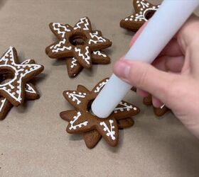 Inserting a candle to complete the Christmas cookie candle