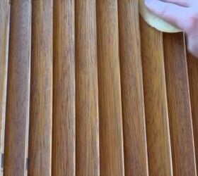 Preparing closet doors by sanding each panel