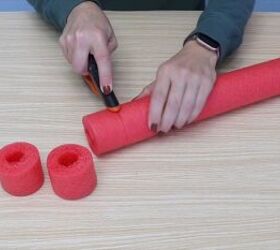 Cutting small sections from the pool noodle to create marshmallows