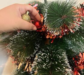 Decorate your tree with tinsel, lights, and ornaments to make it pop