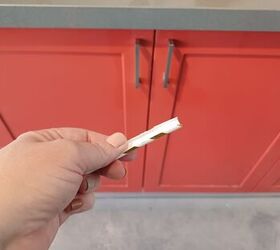 She cuts up a few straws for this 2-minute trick to upgrade her kitchen cabinets for Christmas