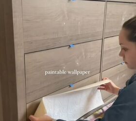 She put a bunch of strips of wallpaper on her shelves for this too-simple-to-be-true makeover
