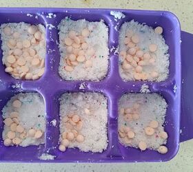 She pours baking soda, salt, and detergent into an ice cube tray for this super smart trick