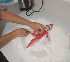 Elf on the shelf making snow angels