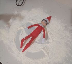 Move the elf's arms and legs in a sliding motion to form a snow angel