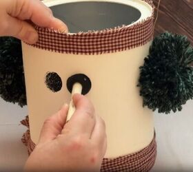 Upcycled snowman made from coffee cans