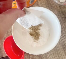 She cuts open a tea bag and sprinkles it into a bowl of baking soda for this 1-minute hack