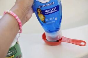 Squeeze some Dawn dish soap into vinegar for this clever bathroom hack